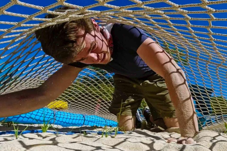 <p>CBS</p> Charlie competes in a challenge during episode 10