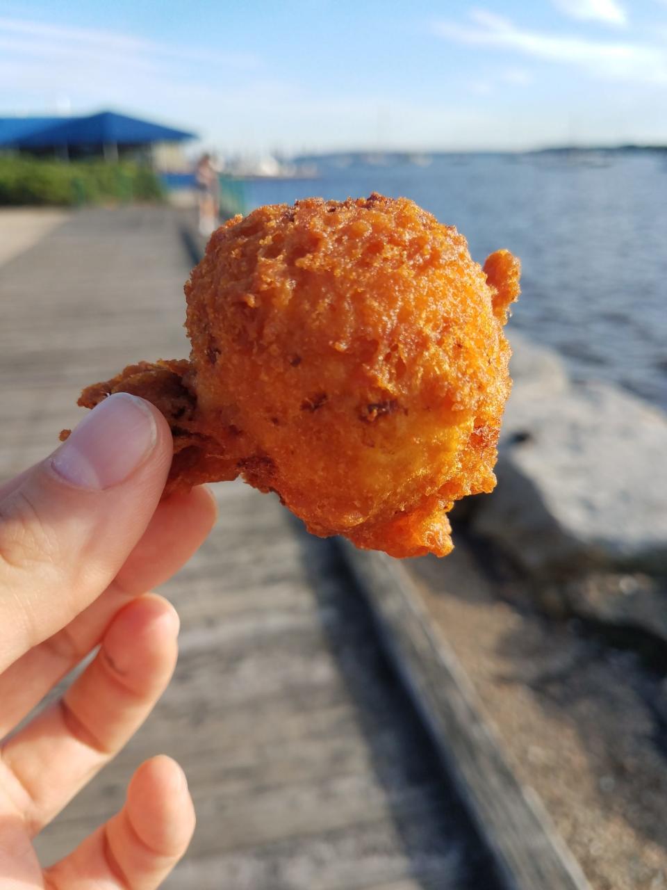 A Quito's Clam Shack clam cake by the water in Bristol.
