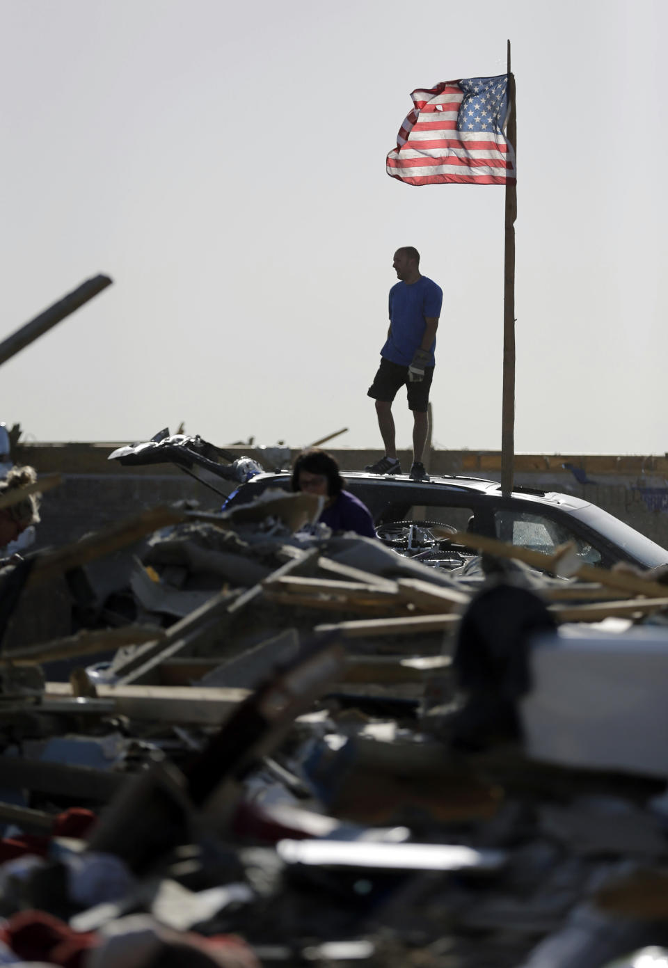 Nick Conway surveys his tornado destroyed home, Monday, April 28, 2014, in Vilonia, Ark. Arkansas Gov. Mike Beebe has asked for a Major Disaster Declaration for Faulkner County, which was hit hardest by a deadly tornado that rolled through the state. (AP Photo/Eric GayAP Photo/Eric Gay)