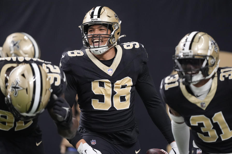 New Orleans Saints defensive end Payton Turner (98) celebrates after he recovers a fumble near the end zone in the second half of an NFL football game against the in New Orleans, Sunday, Jan. 7, 2024. (AP Photo/Gerald Herbert)