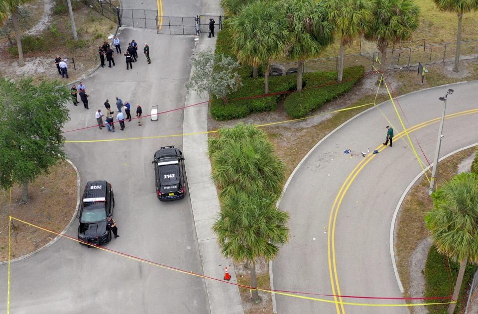 Police investigate the scene of an early morning shooting in the parking lot of Suncoast Community High School on April 22, 2024 in Riviera Beach, Florida. No students or staff were injured.