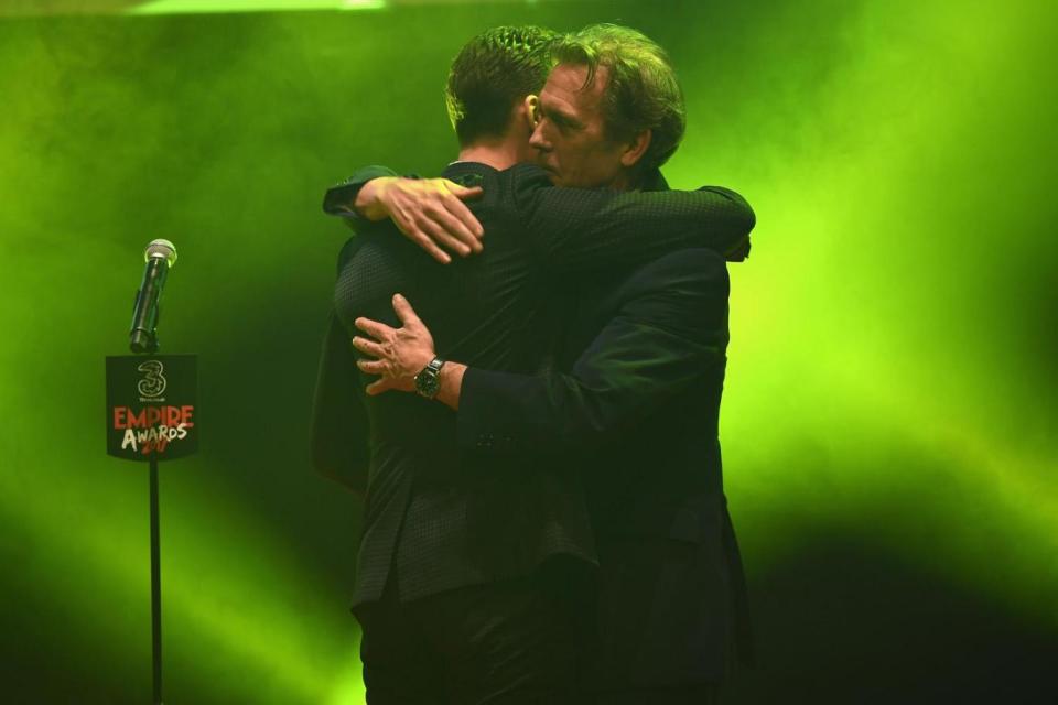 Congratulations: Hugh Laurie with Tom Hiddleston on stage (Getty Images)