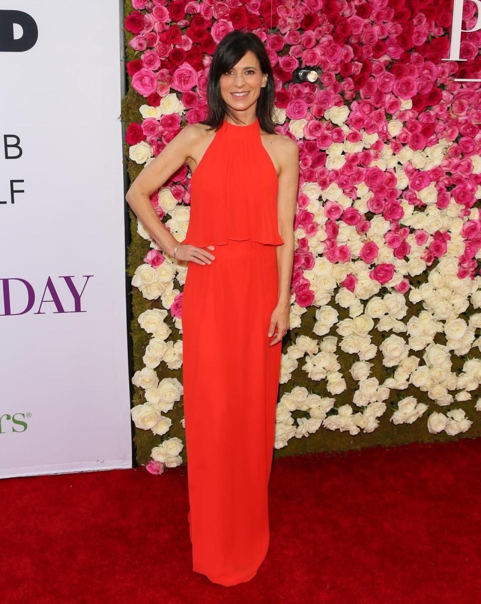 Perrey Reeves in a red halter dress 