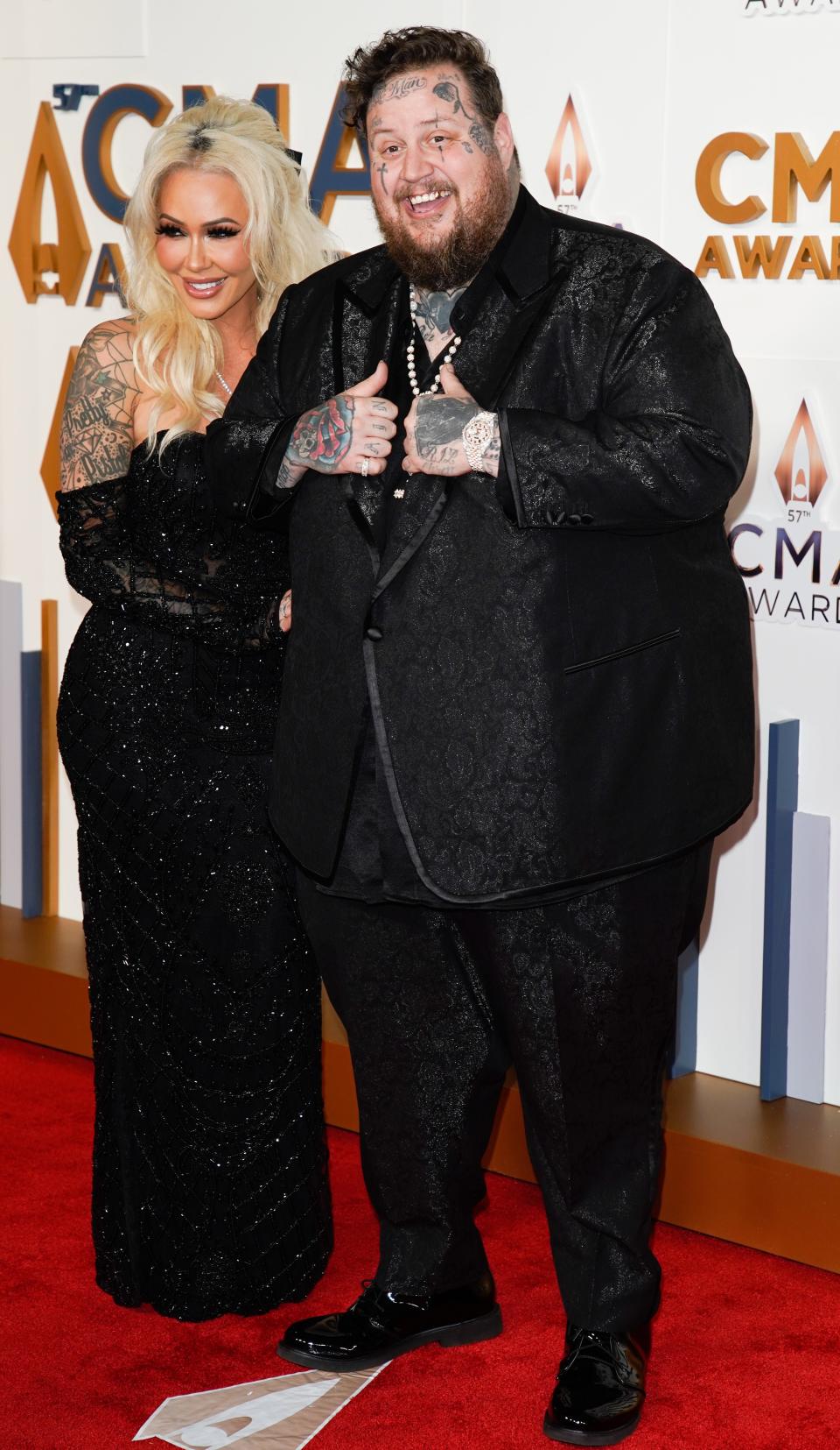 Jelly Roll and his wife, Bunnie XO, walk the red carpet during the 57th Annual Country Music Association Awards in Nashville, Tenn., Wednesday, Nov. 8, 2023.