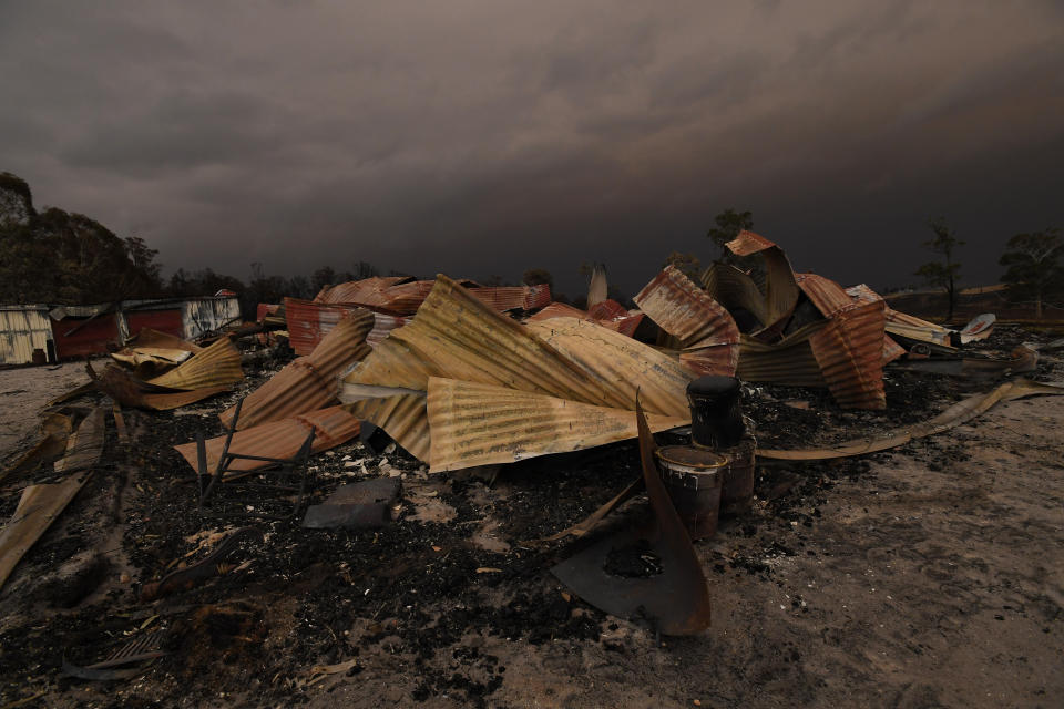 Remains of a burnt-out property that was impacted by a blaze in late December is seen at Bruthen South, Victoria, Saturday, January 4, 2019. Twenty-two people are dead, 21 more are missing and more than 1500 homes have been destroyed as fires burned through over six-million hectares of land. (AAP Image/James Ross)