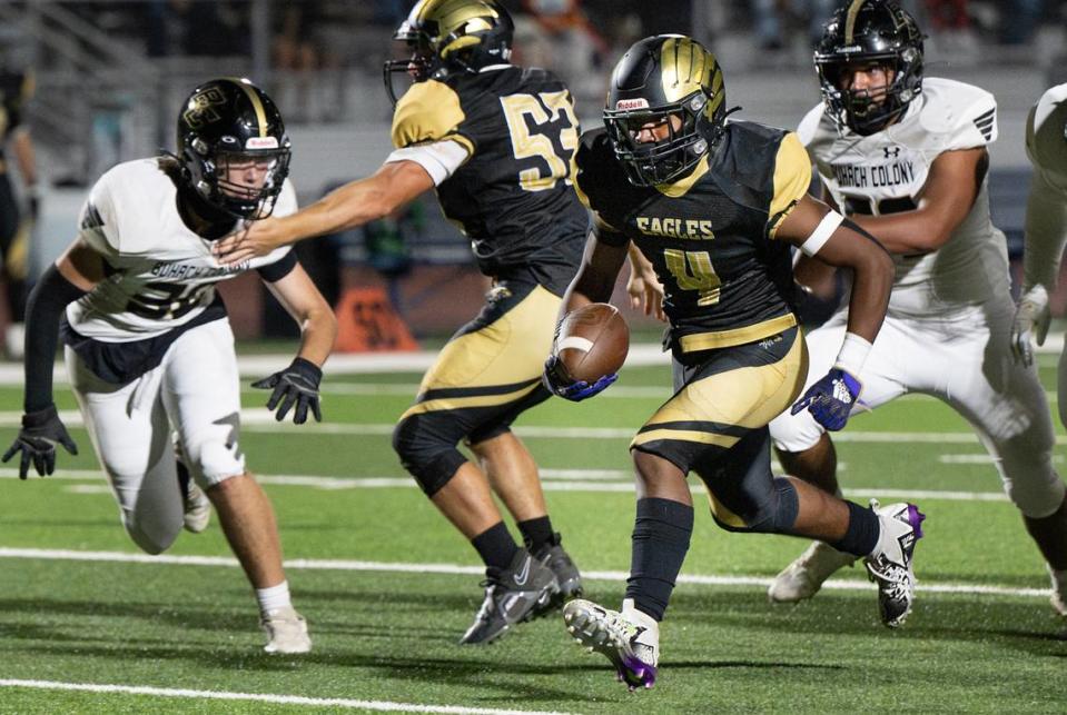 Enochs’ Aiden Muhammad runs the ball during the non-league game with Buhach Colony at Gregori High School in Modesto, Calif., Friday, Sept. 1, 2023. Muhammad rushed for five touchdowns in the Eagles 54-8 win.