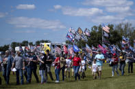 Supporters file into the Georgia National Fairgrounds in Perry, Ga., to attend former president Donald Trump's Save America rally Saturday, Sept. 25, 2021. (AP Photo/Ben Gray)