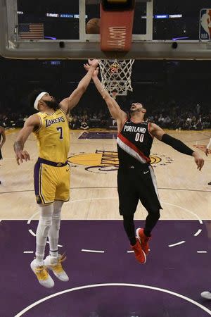 Apr 9, 2019; Los Angeles, CA, USA; Los Angeles Lakers center JaVale McGee (7) and Portland Trail Blazers center Enes Kanter (00) fight for the rebound during the second half at Staples Center. Mandatory Credit: Richard Mackson-USA TODAY Sports