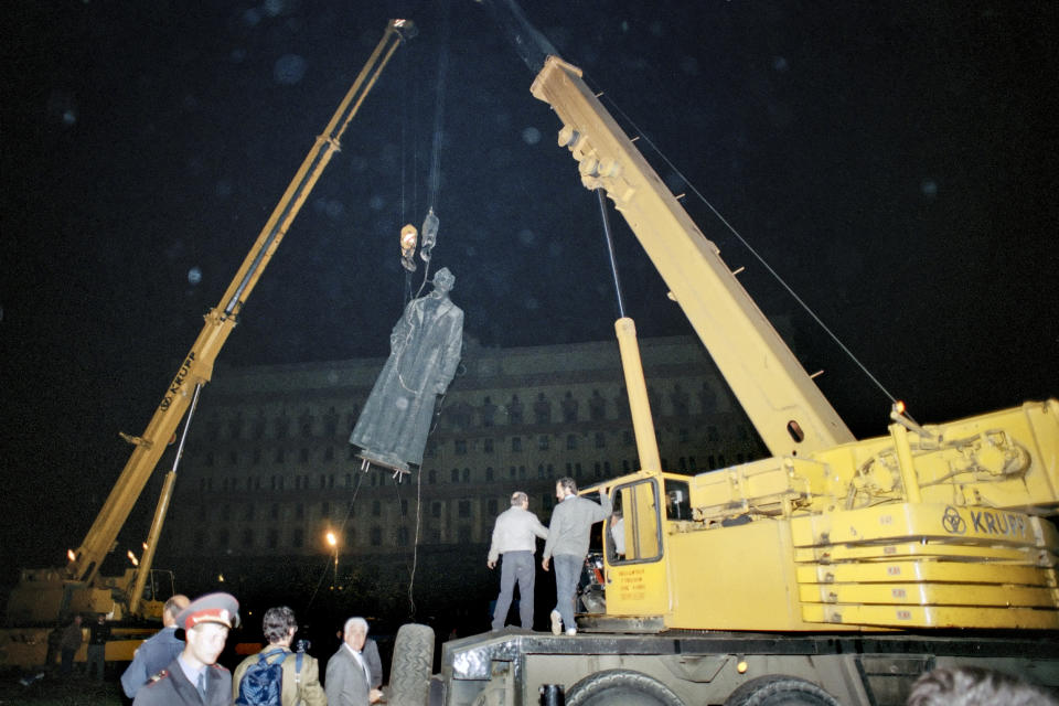 FILE - In this Friday, Aug. 23, 1991 file photo, The statue of the founder of the KGB, Felix Edmundovich Dzerzhinsky, is toppled off its pedestal in front of KGB headquarters in Moscow, Russia. When a group of top Communist officials ousted Soviet leader Mikhail Gorbachev 30 years ago and flooded Moscow with tanks, the world held its breath, fearing a rollback on liberal reforms and a return to the Cold War confrontation. But the August 1991 coup collapsed in just three days, precipitating the breakup of the Soviet Union that plotters said they were trying to prevent. (AP Photo/Alexander Zemlianichenko, File)