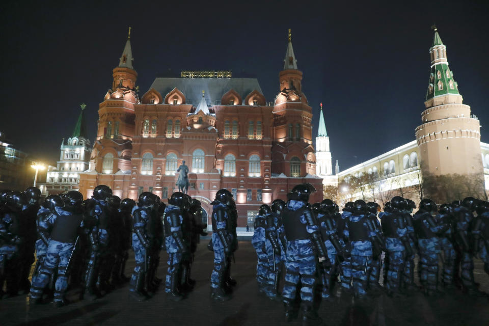 Servicemen of the Russian National Guard (Rosgvardia) gather at the Red Square to prevent a protest rally in Moscow, Russia, Tuesday, Feb. 2, 2021. A Moscow court has ordered Russian opposition leader Alexei Navalny to prison for more than 2 1/2 years on charges that he violated the terms of his probation while he was recuperating in Germany from nerve-agent poisoning. Navalny, who is the most prominent critic of President Vladimir Putin, had earlier denounced the proceedings as a vain attempt by the Kremlin to scare millions of Russians into submission. (AP Photo/Pavel Golovkin)