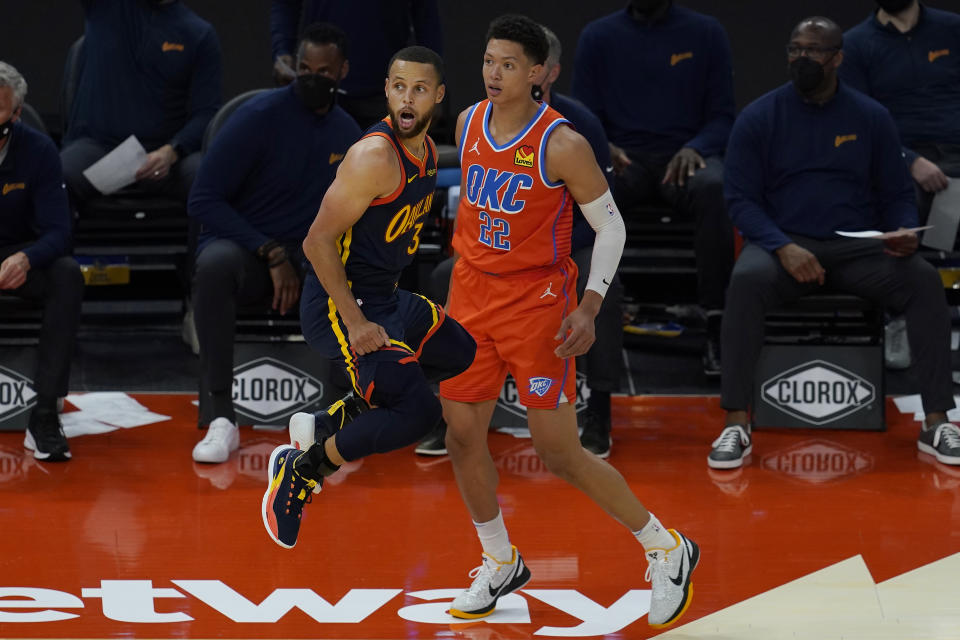 Golden State Warriors guard Stephen Curry (30) reacts as he misses a three-point attempt in front of Oklahoma City Thunder center Isaiah Roby (22) during the first half of an NBA basketball game in San Francisco, Thursday, May 6, 2021. (AP Photo/Jeff Chiu)