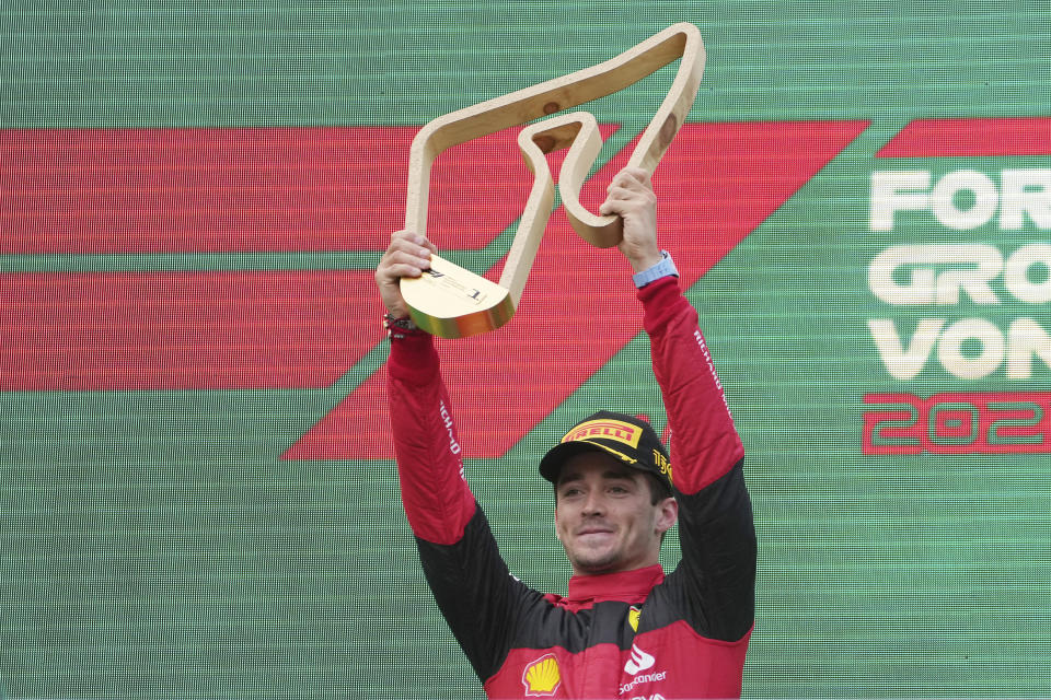 Ferrari driver Charles Leclerc of Monaco celebrates on the podium after winning the Austrian F1 Grand Prix at the Red Bull Ring racetrack in Spielberg, Austria, Sunday, July 10, 2022. (AP Photo/Matthias Schrader)