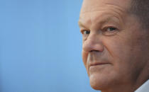 German Chancellor Olaf Scholz attends his first annual summer news conference in Berlin, Germany, Thursday, Aug. 11, 2022. (AP Photo/Michael Sohn)