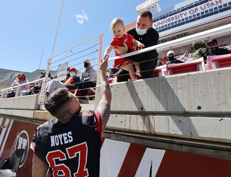 Utah Utes kicker Jordan Noyes talks with his daughter Scottie during the Red and White game in Salt Lake City on Saturday, April 17, 2021. | Jeffrey D. Allred, Deseret News