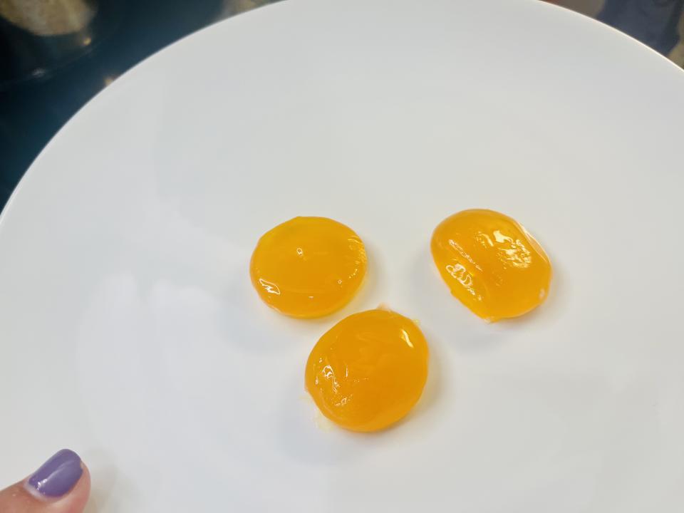 My salt-cured egg yolks after I removed them from their container of salt and gave them a rinse. (Photo: Carly Caramanna)