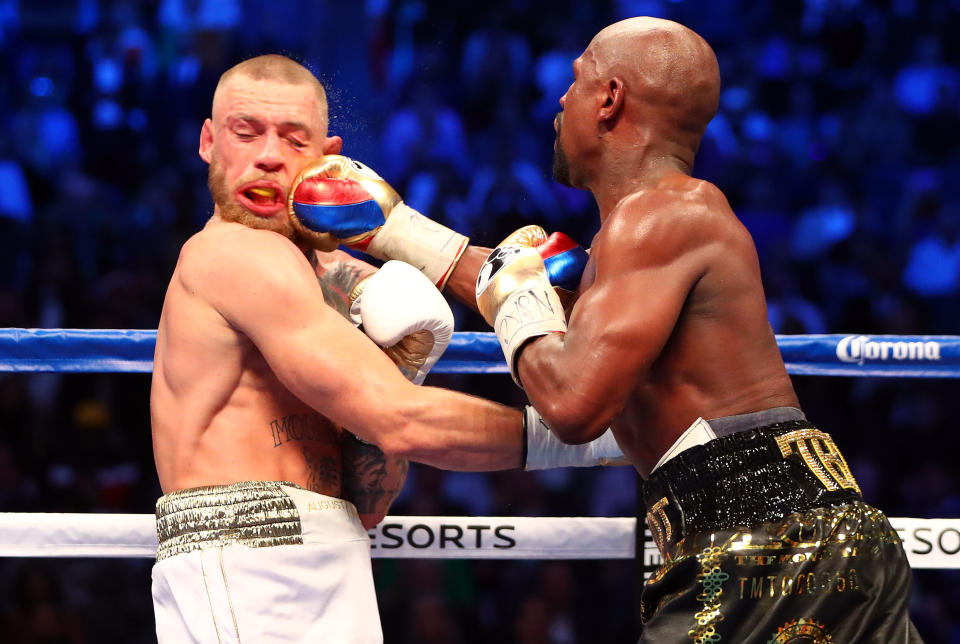 Aug 26, 2017; Las Vegas, NV, USA; Floyd Mayweather Jr. lands a hit against Conor McGregor during the tenth round at T-Mobile Arena. Mandatory Credit: Mark J. Rebilas-USA TODAY Sports