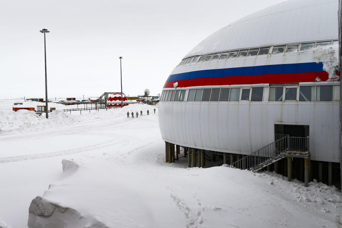 A group of soldiers stand at a central atrium called the "Arctic Trefoil" on the Alexandra Land island near Nagurskoye, Russia, Monday, May 17, 2021. Once a desolate home mostly to polar bears, Russia's northernmost military outpost is bristling with missiles and radar and its extended runway can handle all types of aircraft, including nuclear-capable strategic bombers, projecting Moscow's power and influence across the Arctic amid intensifying international competition for the region's vast resources. (AP Photo/Alexander Zemlianichenko)