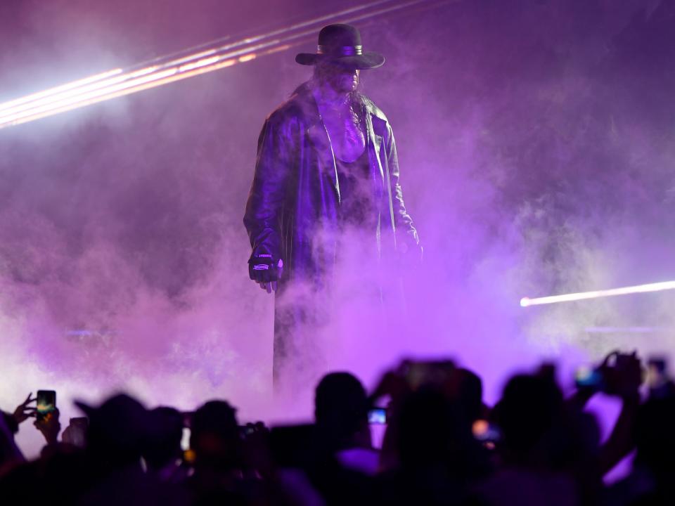 World Wrestling Entertainment star The Undertaker makes his way to the ring during a match at the World Wrestling Entertainment (WWE) Super Showdown event in the Saudi Red Sea port city of Jeddah late on January 7, 2019.