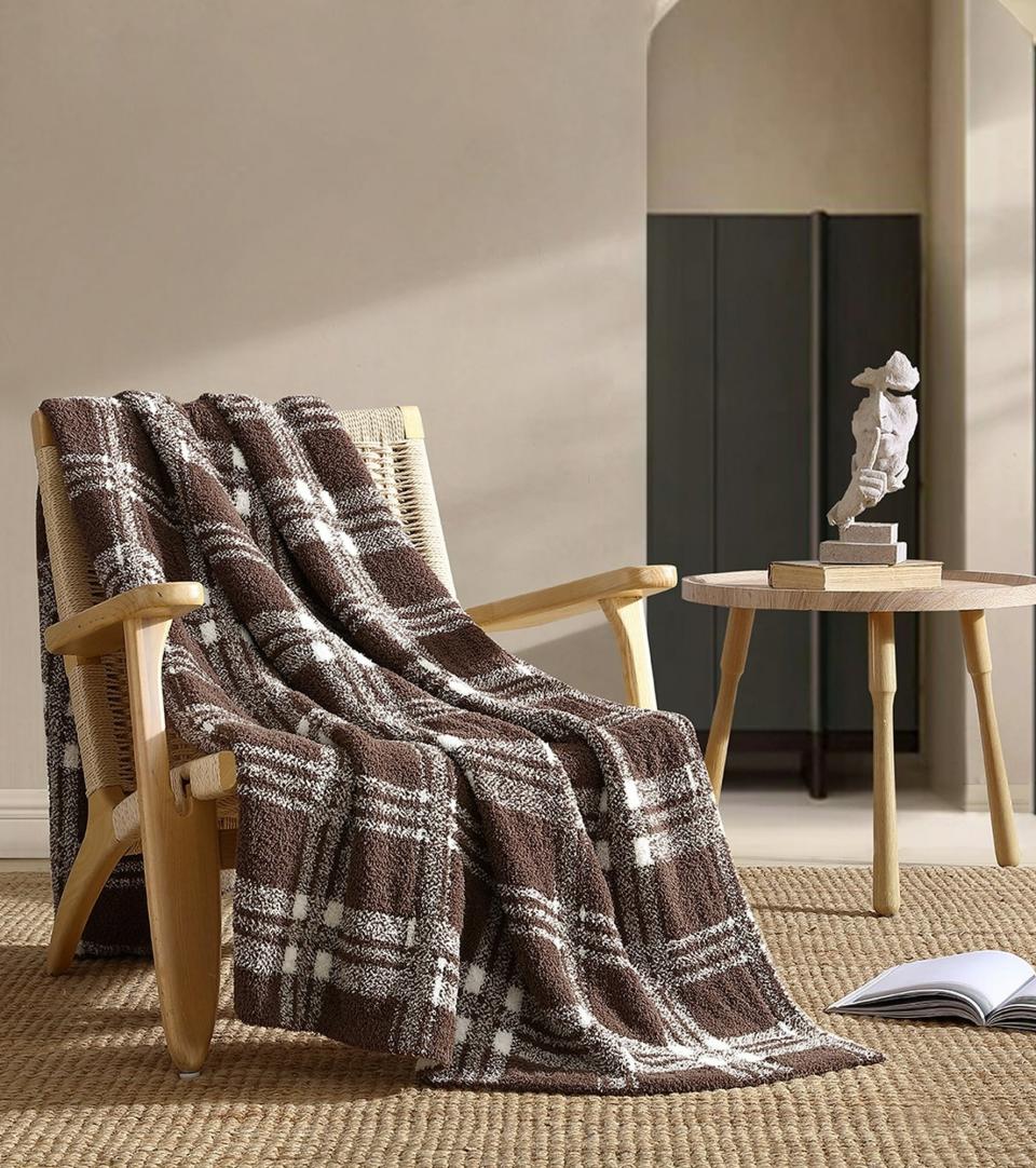 brown and white throw blanket on chair