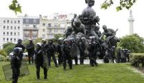 French gendarmes in riot gear gather at the Place de la Nation as they wait for demonstration by labour union members who march in protest of the government's proposed labor law reforms in Paris, France, May 26, 2016. REUTERS/Charles Platiau