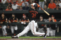Baltimore Orioles' Adley Rutschmann watches his two-run home run against the Boston Red Sox during the fourth inning of a baseball game Friday, Aug. 19, 2022, in Baltimore. (AP Photo/Gail Burton)