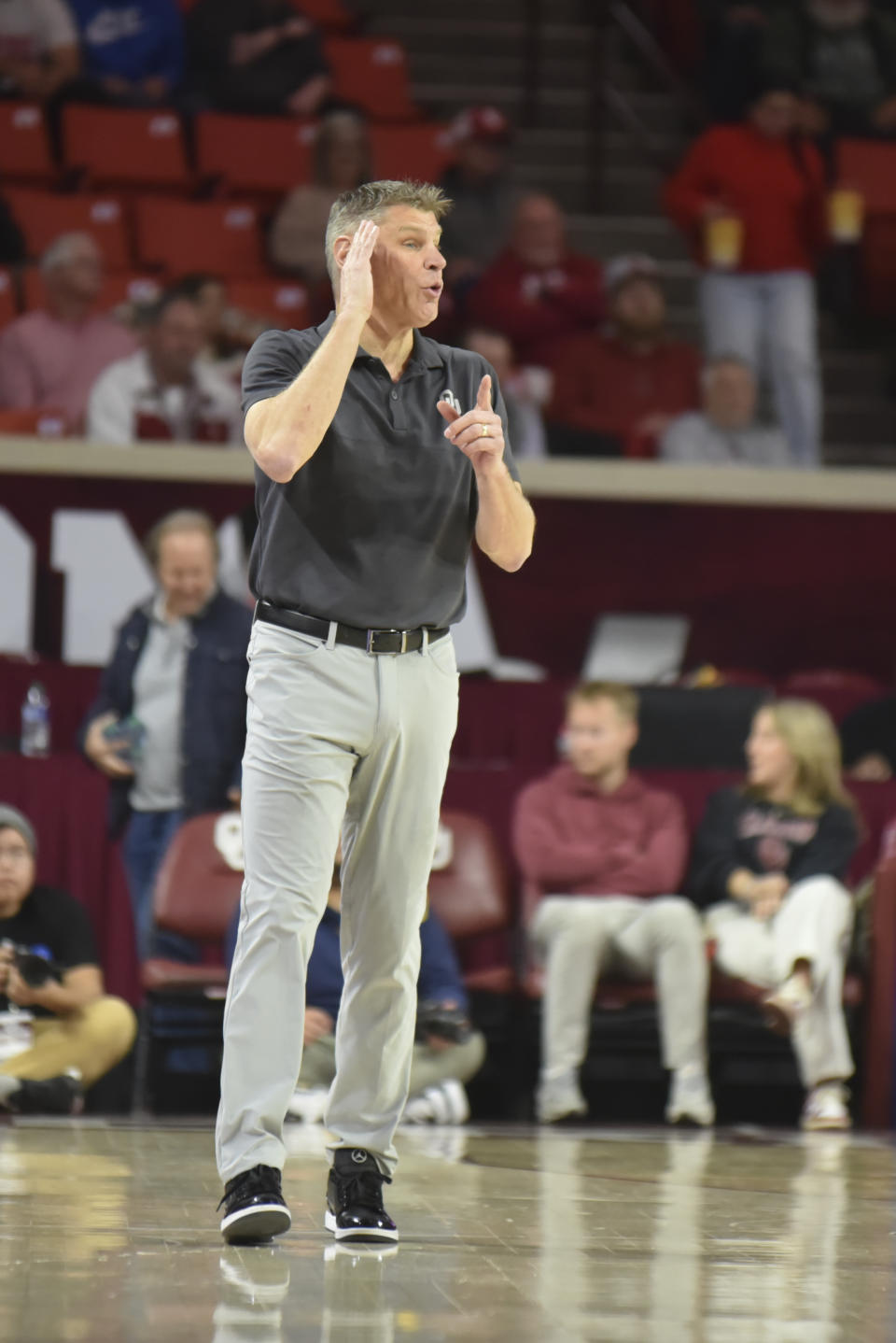 Oklahoma coach Porter Moser gives instructions from the sideline during the first half of the team's NCAA college basketball game against West Virginia, Wednesday, Jan. 17, 2024, in Norman, Okla. (AP Photo/Kyle Phillips)