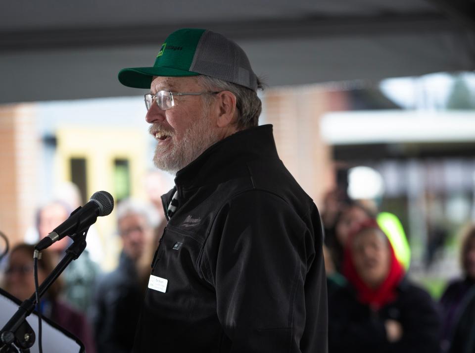 SquareOne Villages executive director Dan Bryant speaks during an open house for Peace Village Co-op in Eugene.