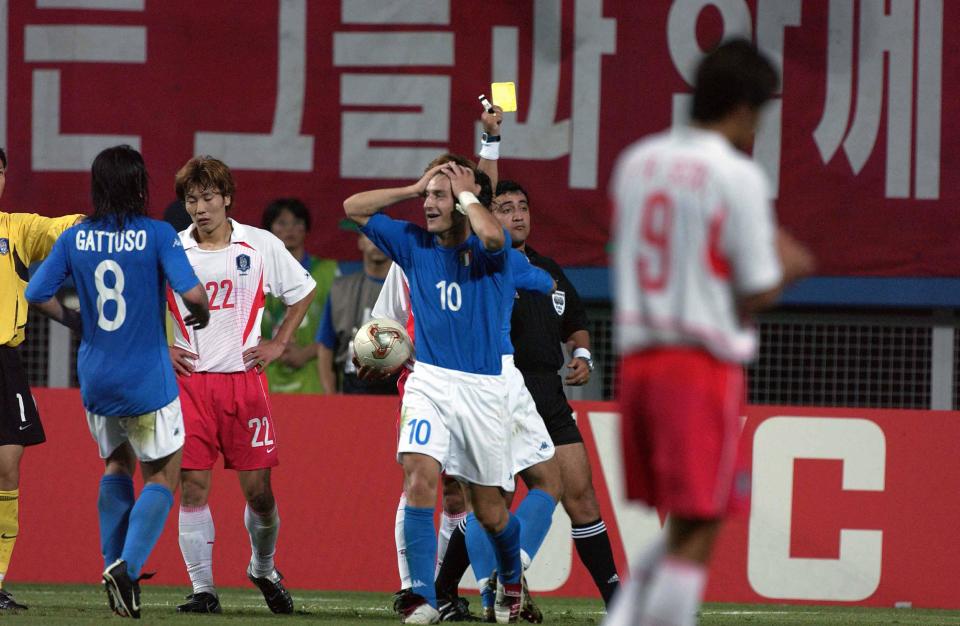 DAEJEON - JUNE 18:  The referee Byron Moreno gives the second yellow card to Francesco Totti of Italy during the South Korea v Italy, World Cup Second Round match played at the Daejeon World Cup Stadium, Daejeon, South Korea on June 18, 2002.