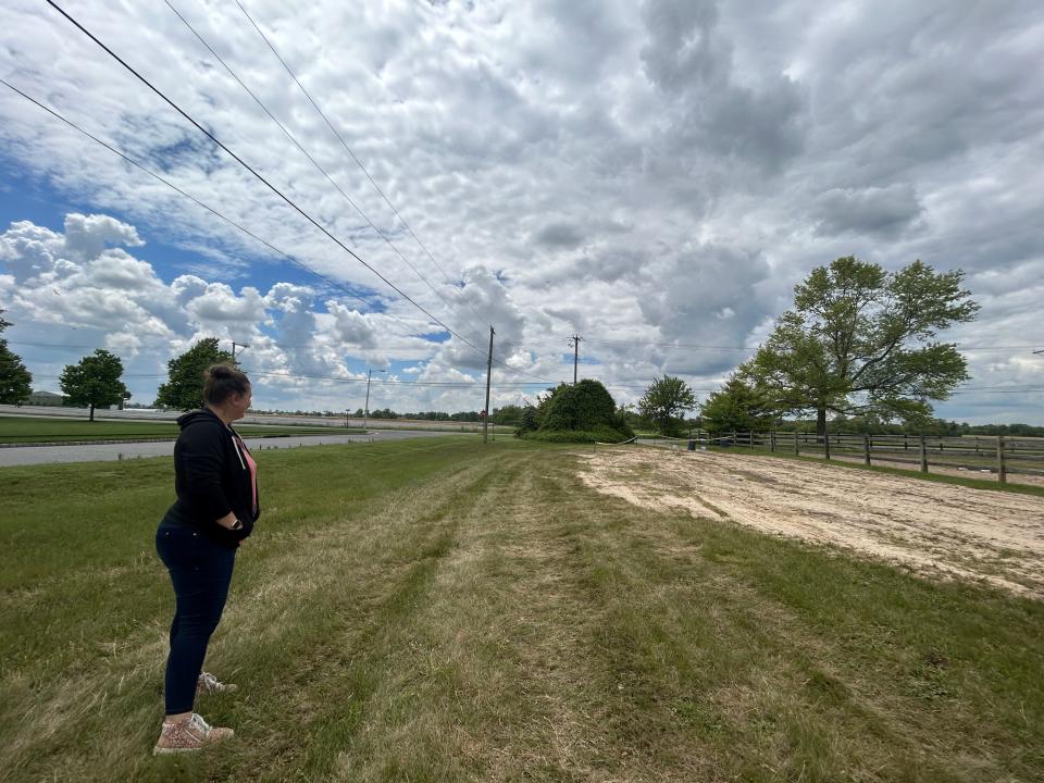 Jessie Hernandez looks out at a parcel of farmland where a proposed warehouse complex would be built. She and other Pilesgrove residents oppose the Auburn Road planned development.