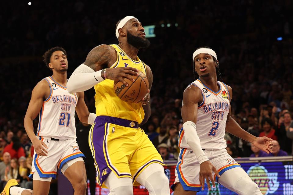 LOS ANGELES, CALIFORNIA - FEBRUARY 07: LeBron James #6 of the Los Angeles Lakers drives to the basket against Shai Gilgeous-Alexander #2 of the Oklahoma City Thunder during the second half of a game at Crypto.com Arena on February 07, 2023 in Los Angeles, California. NOTE TO USER: User expressly acknowledges and agrees that, by downloading and or using this photograph, User is consenting to the terms and conditions of the Getty Images License Agreement. (Photo by Harry How/Getty Images) ORG XMIT: 775871614 ORIG FILE ID: 1463999864