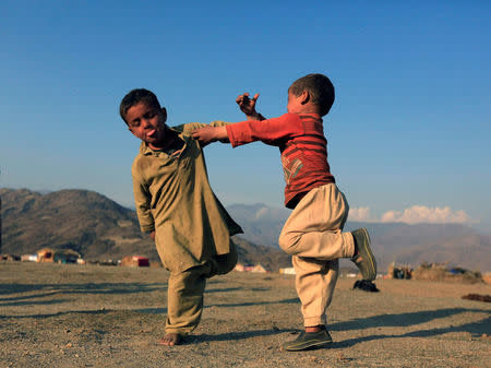 Afghan refugee children play at a refugee camp on the outskirts of Jalalabad, Afghanistan, February 12, 2017. REUTERS/Parwiz