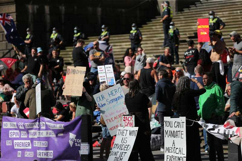 Protesters are seen during a demonstration outside the Victorian State Parliament, in Melbourne.