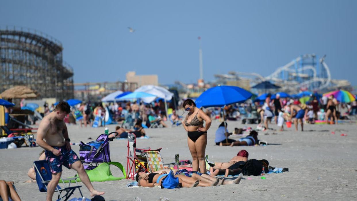 <div>WILDWOOD, NJ - MAY 30: People gather at the beach on May 30, 2022 in Wildwood, New Jersey. Memorial Day events are held across the U.S. to commemorate those who died in active military service. (Photo by Mark Makela/Getty Images)</div>