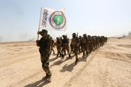 Members of the Shi'ite Badr Organisation undergo training before the upcoming battle to recapture Mosul in Diyala province, Iraq September 27, 2016. REUTERS/Stringer