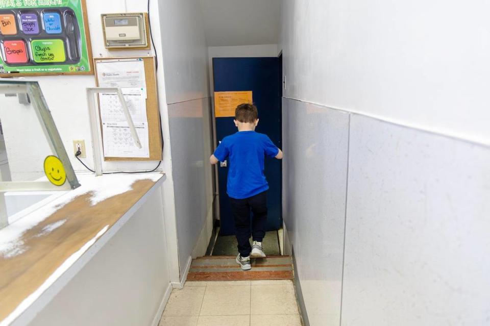 A student navigates a set of stairs in the lunch line at Pioneer Elementary’s cafeteria.