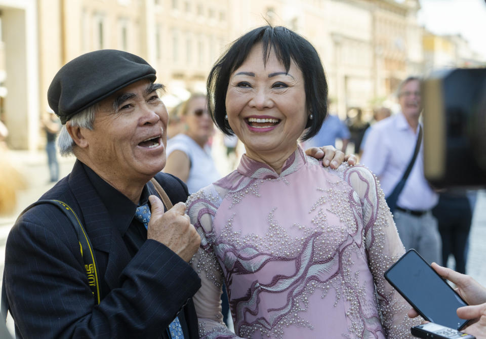 UNESCO Ambassador Kim Phuc, right, and Pulitzer Prize-winning photographer Nick Ut, share a laugh during an interview with The Associated Press after they participated in a general audience with Pope Francis in St. Peter's Square at The Vatican, Wednesday, May 11, 2022. Ut and Phuc are in Italy to promote the photo exhibition "From Hell to Hollywood" resuming Ut's 51 years of work at the Associated Press, including the 1973 Pulizer winning photo of Kim Phuc fleeing her village that was accidentally hit by napalm bombs dropped by the South Vietnamese air force. (AP Photo/Domenico Stinellis)