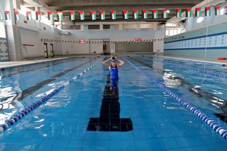 Palestinian swimmer Mary Al-Atrash, 22, who will represent Palestine at the 2016 Rio Olympics, trains in a swimming pool in Beit Sahour, near the West Bank town of Bethlehem, June 27, 2016. REUTERS/Ammar Awad