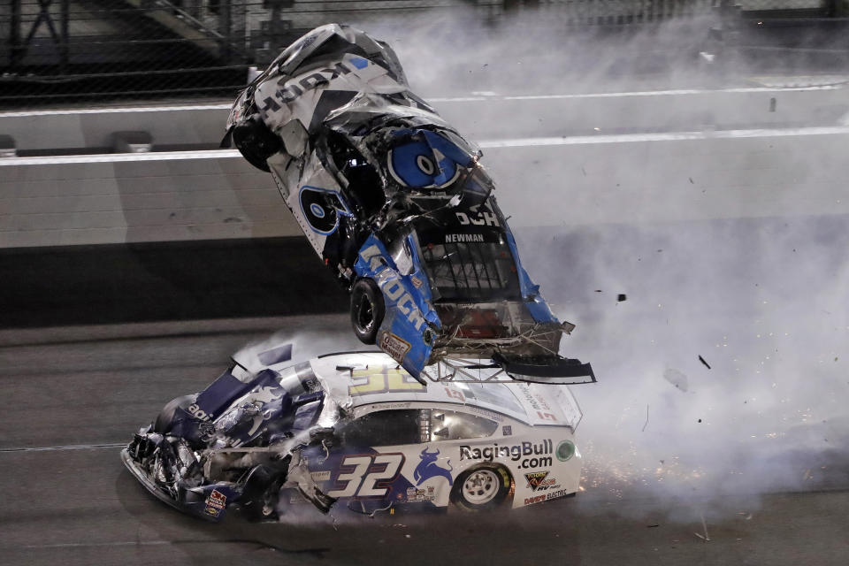 FILE - IN this Feb. 17, 2020 file photo, Ryan Newman (6) goes airborne after crashing with Corey LaJoie (32) during the NASCAR Daytona 500 auto race at Daytona International Speedway in Daytona Beach, Fla. NASCAR's return to racing next shifts to Talladega Superspeedway in Alabama, with a new rules package altered after Ryan Newman's frightful crash in the season-opening Daytona 500. The facility will admit up to 5,000 fans — at the same time at least one NASCAR team is facing a coronavirus scare — while NASCAR will be on the lookout for the newly-banned Confederate flag. (AP Photo/Chris O'Meara, File)