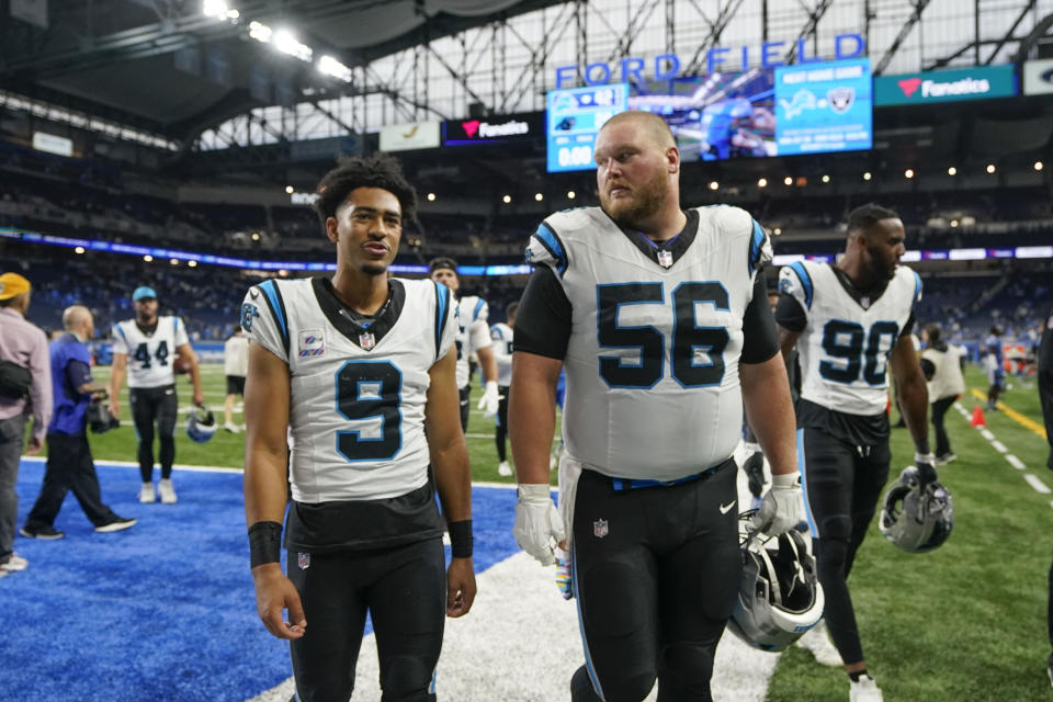 Carolina Panthers quarterback Bryce Young (9) and Carolina Panthers center Bradley Bozeman (56) walk off the field after an NFL football game against the Detroit Lions in Detroit, Sunday, Oct. 8, 2023. The Lions won 42-24. (AP Photo/Carlos Osorio)