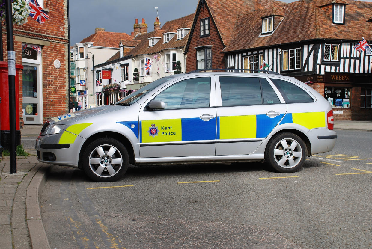 Tenterden, England - July 1, 2012: A Kent police Skoda patrol car parked in the High Street at Tenterden in Kent. Tenterden police station closed in 2012, with policing now provided from neighbouring Ashford.