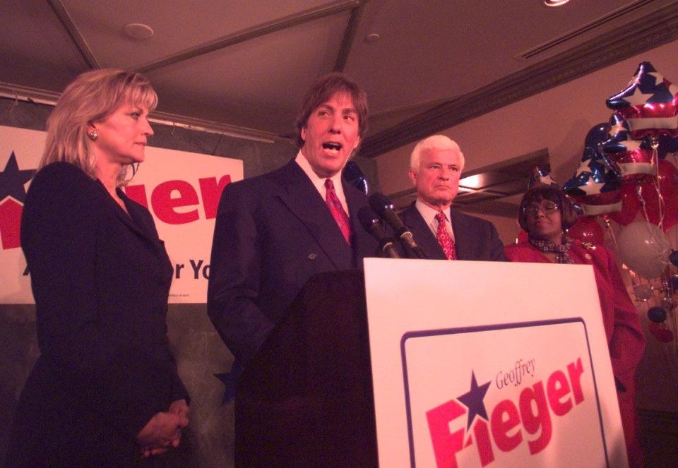 Keenie Fieger(left) and her husband Geoffrey Fieger, and James Agee at a gathering of well-wishers in Detroit late Tuesday night after losing the Gubernatorial election to John Engler.