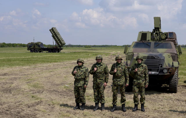 HQ-22 anti-aircraft systems, whose export version is known as FK-3, left, during the military exercises on Batajnica, military airport near Belgrade, Serbia, Saturday, April 30, 2022. Serbia on Saturday publicly displayed a recently delivered Chinese anti-aircraft missile system, raising concerns in the West and among some of Serbia's neighbors that an arms buildup in the Balkans could threaten fragile peace in the region. (AP Photo/Darko Vojinovic)