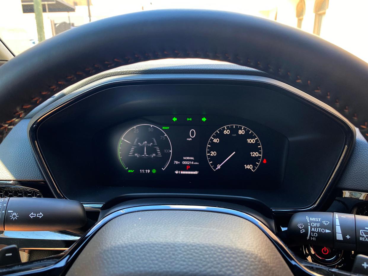 The seven-inch digital gauge display on a 2025 Honda CR-V Hybrid Sport Touring SUV showing the traction breakdown of the AWD system.