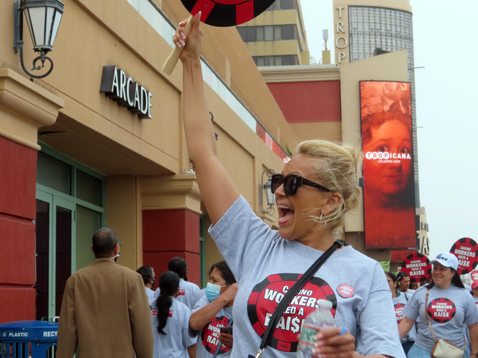 Members of Local 54 of the Unite Here casino workers union picket outside the Tropicana casino in Atlantic City, N.J., on June 1, 2022. On June 15 the union's members will vote on whether to authorize a strike against the city's casinos if new contracts are not reached soon. (AP Photo/Wayne Parry)