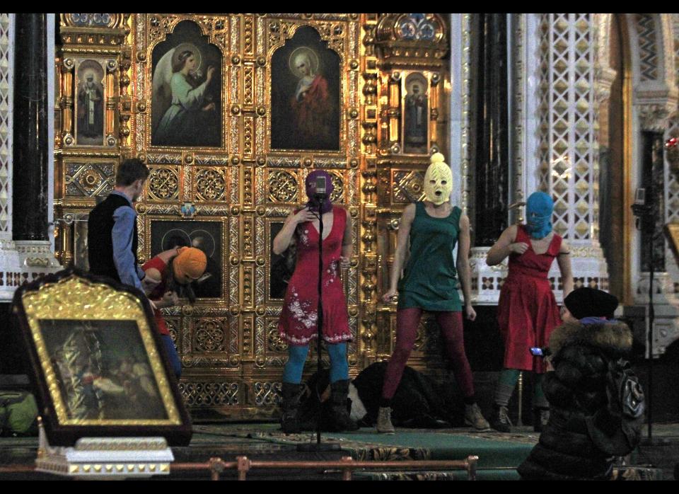 In Feb. 21, 2012, file photo, members of the Russian radical feminist group Pussy Riot tried to perform at the Christ the Saviour Cathedral in Moscow. 