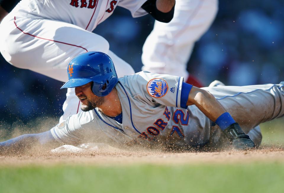 New York Mets' Jack Reinheimer is picked off at first base after attempting to steal second during the eighth inning of a baseball game against the Boston Red Sox in Boston, Sunday, Sept. 16, 2018. (AP Photo/Michael Dwyer)