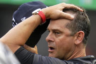 New York Yankees manager Aaron Boone stands in the dugout during the first inning of the team's baseball game against the Pittsburgh Pirates in Pittsburgh, Tuesday, July 5, 2022. (AP Photo/Gene J. Puskar)