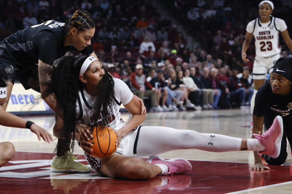 South Carolina center Kamilla Cardoso controls a loose ball against Vanderbilt forward Sacha Washington, left, during the first half of an NCAA college basketball game in Columbia, S.C., Sunday, Jan. 28, 2024. (AP Photo/Nell Redmond)