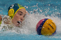 Australia's Elle Armit (5) swims after the ball during a preliminary round women's water polo match against Canada at the 2020 Summer Olympics, Saturday, July 24, 2021, in Tokyo, Japan. (AP Photo/Mark Humphrey)