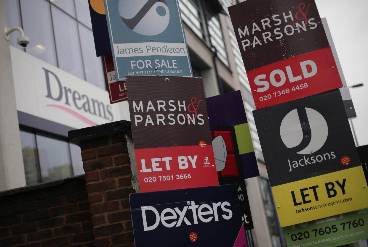 Various ‘for sale’, ‘sold’ and ‘let by’ estate agent signs juxtaposed next to a Dreams store in Clapham, London. Photo: Yui Mok/PA Images via Getty Images